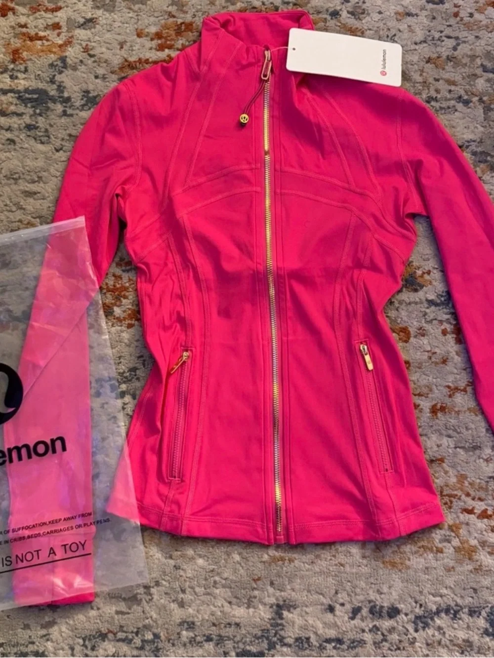 lululemon bright pink jacket with gold zipper